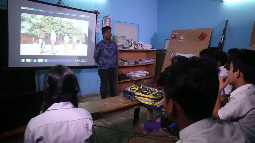 Students watching a projected film in class