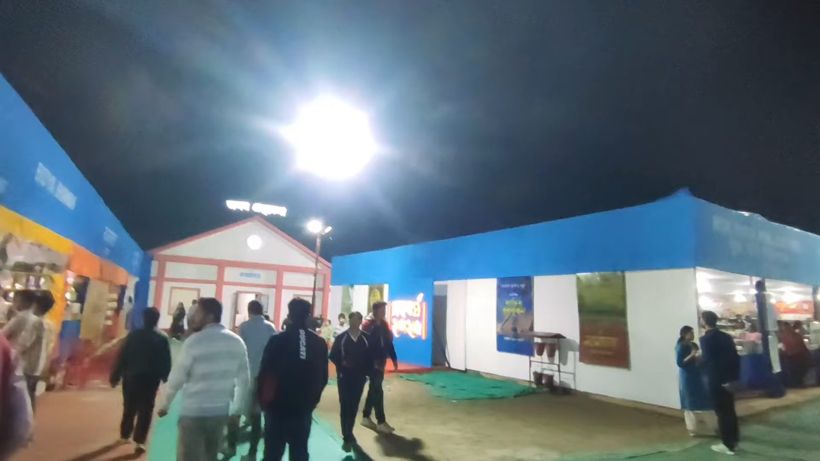 The book fair entrance lit up at night