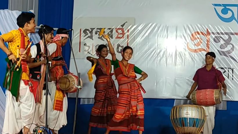 Students performing with dhol and song